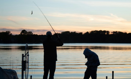 The essence of exceptional living people fishing at sunset